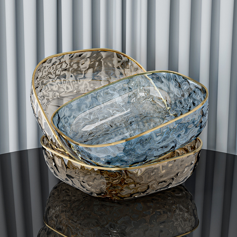 Golden rim water ripple tray utilized in a premium hotel buffet display for fresh fruits
